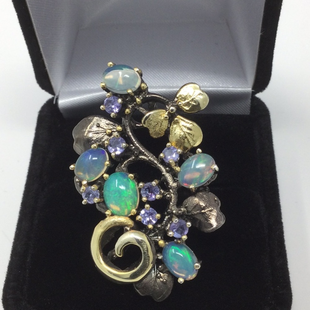 Awe inspiring Genuine Opals & Tanzanite Ring